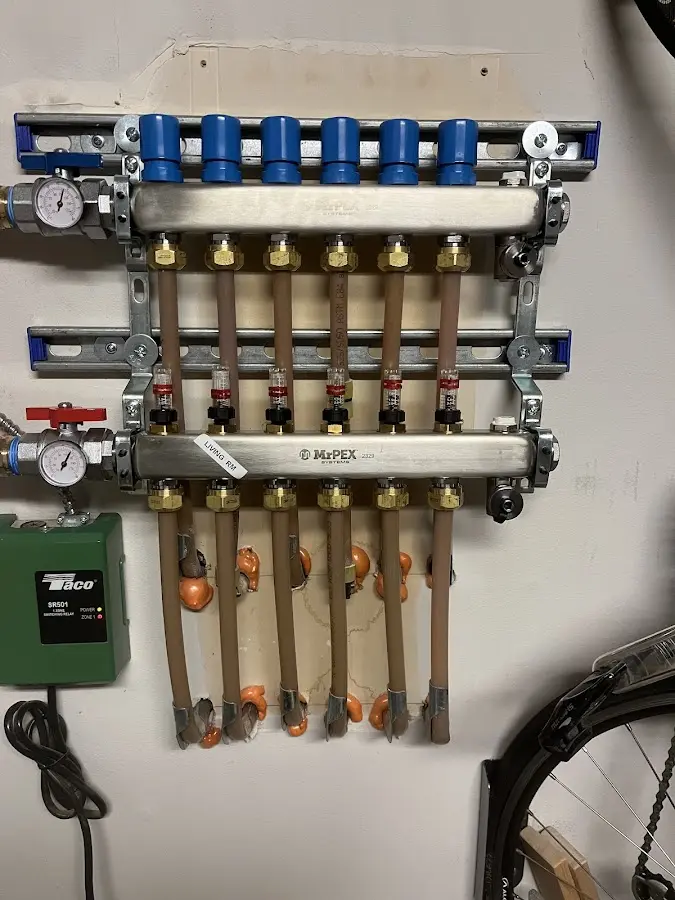 Plumber performing Gas Line Installation at a residential property in Glen Cove